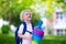 Little child with candy cone on first school day