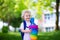 Little child with candy cone on first school day