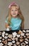 Little child decorating cookies with icing