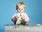 Little child with dollars on table