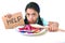 Little child eating sweet sugar in candy dish holding sugar spoo