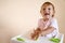 Little child engaged in playdough modeling at table, copy space. lifestyle