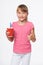 Little child girl holding a drink in disposable paper cup