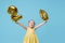 Little child girl is holding foil balloons in the form of numbers 20 twenty percent. The concept of discounts,