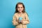 Little child girl holding milkshake in disposable paper cup