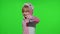 Little child girl smiling, showing thumbs up gesture, agree sign in unicorn pajamas on chroma key