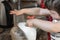 Little child helps mom in the kitchen with cooking. whipping food in a combine