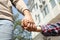 Little child holding hands with his father  outdoors, closeup.