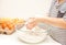 Little child in the home kitchen preparing dough for pizza or another food