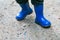 Little child legs in rain boots