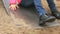 Little child moving down on a steel slide outdoors