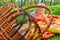 Little child in a park on green grass on a litter in a straw basket