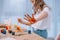 little child showing colorful dirt hand while