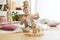 Little child sitting on the floor. Pretty boy palying with wooden cubes at home