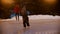 A little child trying to skate on the ice rink