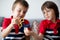 Little children, boy brothers, playing with colorful fidget spin