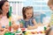 Little children building block toys at home or daycare. Kids playing with color blocks. Educational toys for preschool