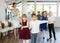 Little children in elegant dresses practicing waltz dance in school hall