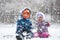 Little Children Enjoying Snowfall