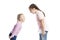Little children, girlfriends in pink sweaters and jeans shout at each other. Anger and stress. Isolated over white background