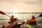 Little children kayaking on river, back view. Summer camp activity