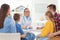 Little children with parents visiting doctor