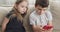 Little children playing game on mobile phone