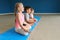 Little children practicing yoga indoors