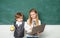 Little children at school lesson. Couple of schoolgirl and schoolboy in Love together. Ready for school. School kids