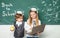 Little children at school lesson. Couple of schoolgirl and schoolboy in Love together. Ready for school. School kids