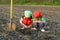 Little children with shovel on field