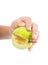 Little childs hand holding an unripe green apple