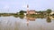 Little church reflecting in a rice field in Italy