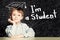 Little Clever boy pupil on blackboard portrait.