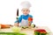 Little cook with knife and tomatoes
