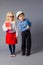 The little couple in costumes of teacher and engineer