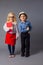 The little couple in costumes of teacher and engineer
