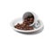 Little cup with scattered coffee beans lying on saucer