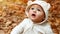 Little curious boy in autumn forest