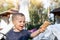 Little cute adorable playful caucasian blond toddler boy kid sharing sweet tasty ice cream with mom on hot summer day