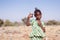 Little and cute African girl posing for the camera with hand gestures