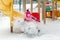 Little cute baby girl having fun on playground at winter. Children winter sport and leisure outdoor activities