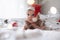 little cute baby girl portreit in red christmas santa hat with lights