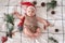Little cute baby girl portreit in red christmas santa hat with lights top view. Christmas holidays concept