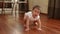 Little cute baby girl stand up to its feet in slow motion