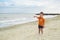 A little cute baby plays on the beach. Baby on the beach near the sea in summer