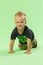 Little cute blond boy crawling, smiling