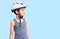 Little cute boy kid wearing bike helmet looking away to side with smile on face, natural expression