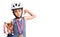 Little cute boy kid wearing bike helmet and winner medals holding winner trophy with angry face, negative sign showing dislike