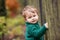 Little cute boy in the park. Close up picture of Lovelyl ittle boy in the autumn garden. Outdoor activities for children